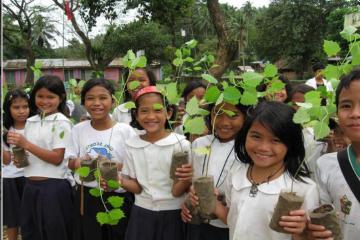 CFP students holding the seedlings prior to the tree planting activity