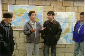 Mr. Sakurai presenting to the Nugedi Villagers the advantages of planting Japanese variety of apple.